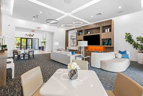 a living room with couches and chairs and a table